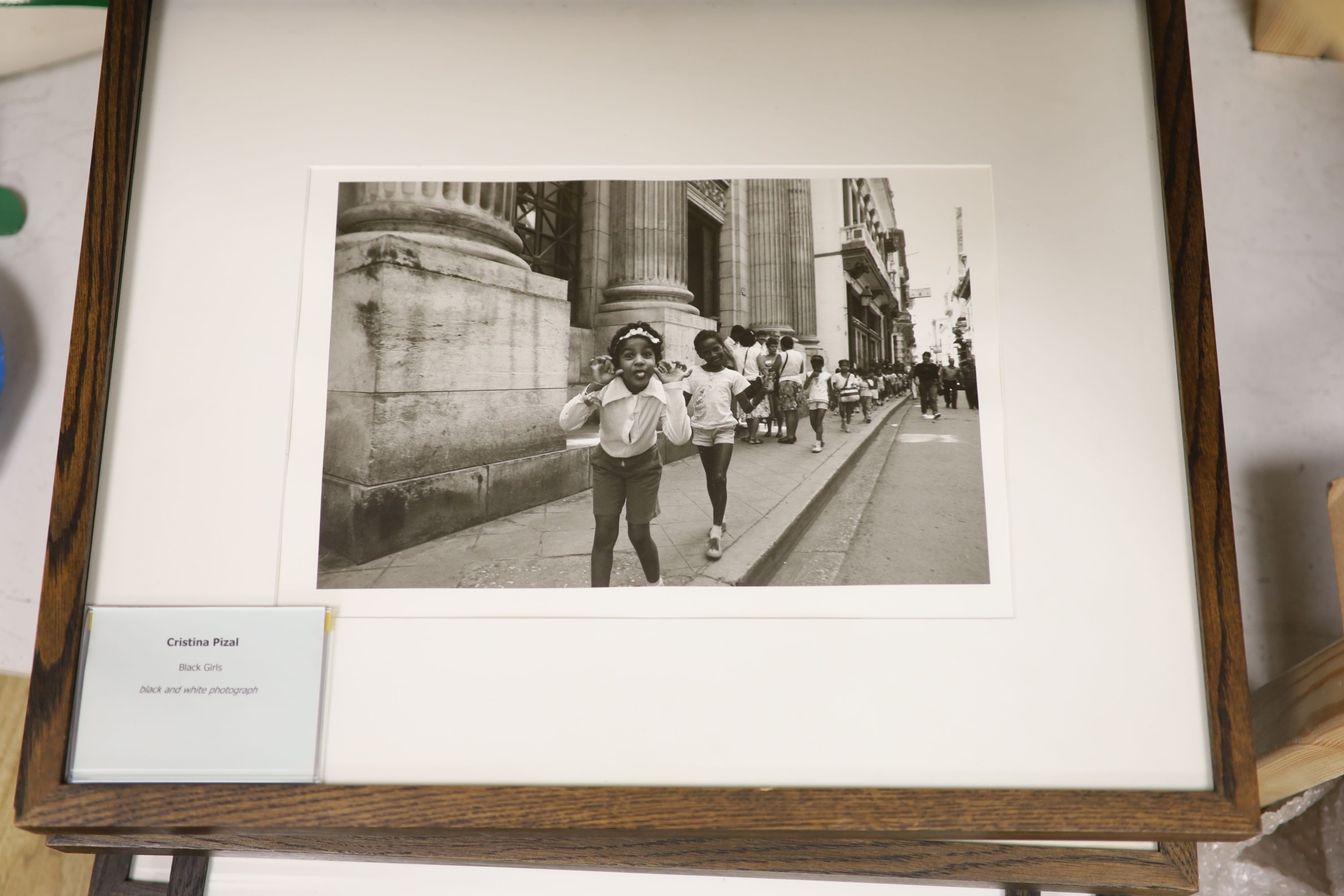 A collection of modern black and white photographs: Henk Jonker, Children and organ grinder, Roger Mayne, Please Mr Take My Photo, Unknown, The Village Hall, Christian Pizal